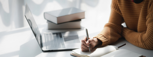 Image of a woman writing.