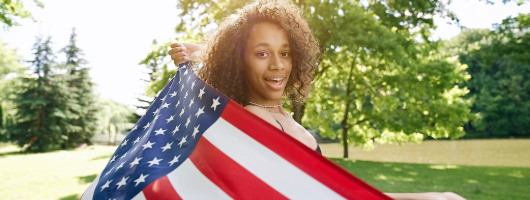 Woman holding American flag.