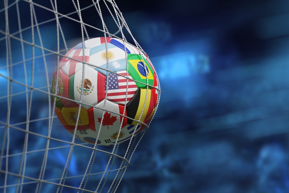 Image of a soccer ball covered in national flags.