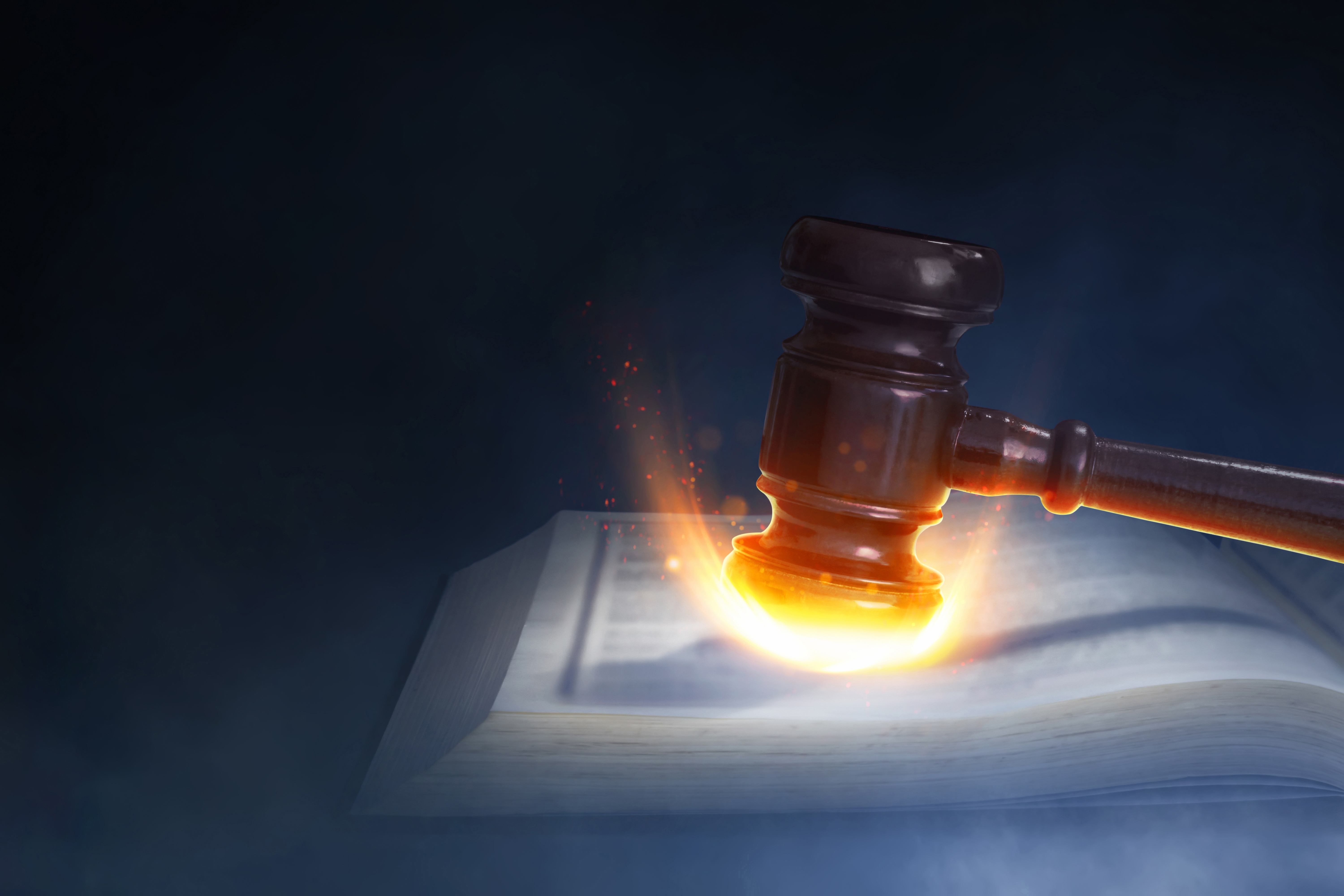 Stylish image of a flaming gavel coming down.